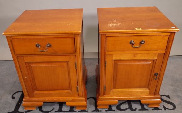 A pair of 20th century cherrywood single drawer bedside cupboards, on bracket feet, 43cm wide x 62cm high, (2).  A1