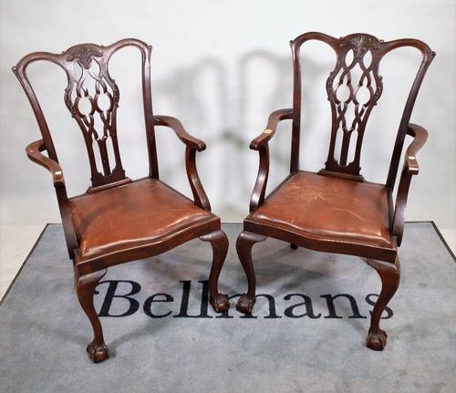 A pair of late Victorian mahogany open armchairs, on ball and claw feet, 58cm wide x 102cm high.  C3