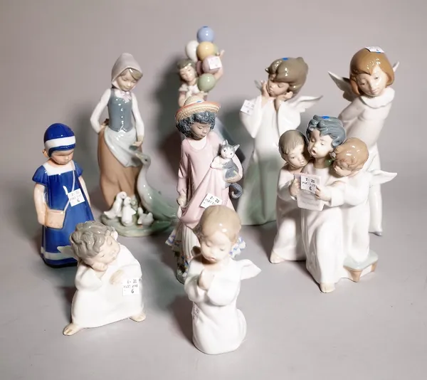 A group of eight Lladro figurines, one Nao figurine and one Royal Copenhagen figure, the largest 26cm high, (10). S3T