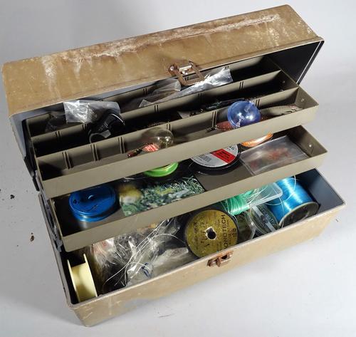 A Focus tackle/ tool box full of fly tying materials, salmon and trout hooks all unused, a Farlows rig/ cast wallet and other pieces, (qty).  S3M