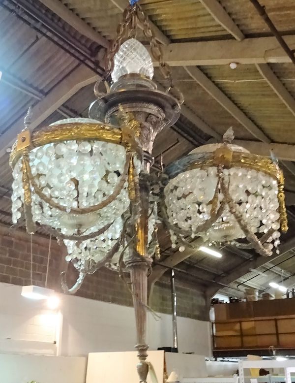 A French gilt metal and cut glass chandelier, modelled as a torch flanked by three baskets, 100cm high.   D3