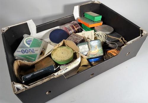 A large fruit box with a tackle box and lures, fly boxes, fly lines and further fishing items, (qty).  S3M