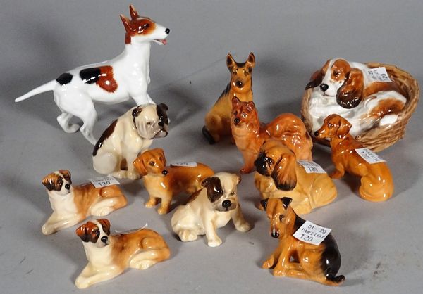 Royal Doulton; a group of twelve various dog finials, the largest 9cm high.  CAB