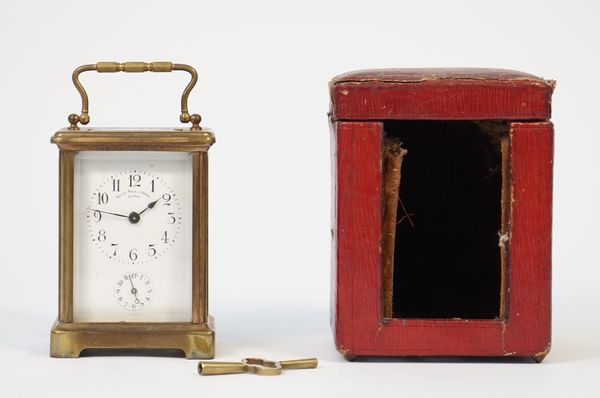 A Swiss brass cased carriage clock, late 19th century, by Golay Fils and Stahl Geneve, with visible platform escapement, enamelled dial with subsidiar