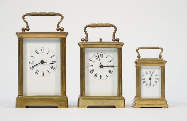 A French brass cased carriage clock, early 20th century, with push repeat, visible platform escapement and two train movement, 10cm high and two furth