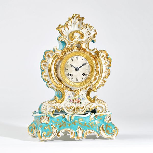 A Paris porcelain mantel clockPossibly Jacob Petit, circa 1850 of shaped outline with parcel-gilt decoration on a torquoise ground, naturalistically m