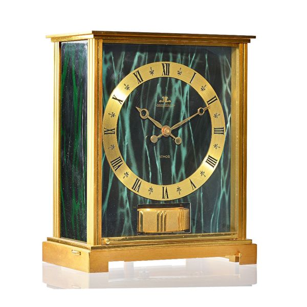 A Jaegar Le Coultre brass cased Atmos clock, "Embassy green", circa 1991, model No 5905, case No 392891, 21.7cm high. Illustrated.