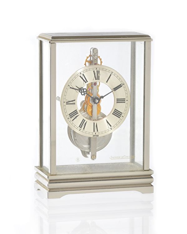 A Jaegar Le Coultre skeleton desk clock 'No 533' brushed and polished chrome rectangular case, 10.5cm high, with faux leather travel case. Illustrated