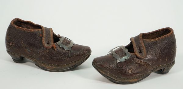 A pair of Georgian child's leather shoes, with metal buckles and wooden soles, 13cm, (2).