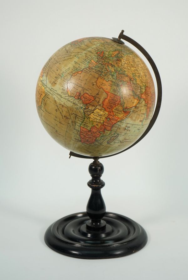 A Geographia 10 inch Terrestrial table globe, on a turned ebonised wooden stand, 46cm high.