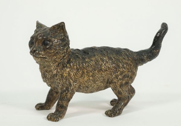 A Bergmann style Austrian cold painted bronze cat, late 19th century, modelled standing, stamped 'GESCHUTZ', 11.3cm high.