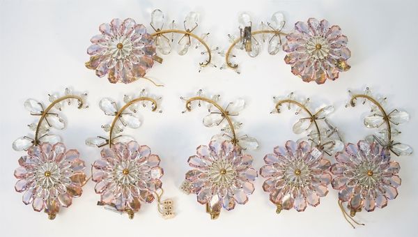 A set of seven gilt metal and coloured glass single branch wall lights, each modelled as a flowerhead and stem, 30cm high, (7).