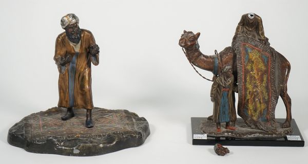 An Austrian cold painted spelter figure of a Persian male carpet vendor, 20cm high and one further Austrian cold painted spelter figure group depictin