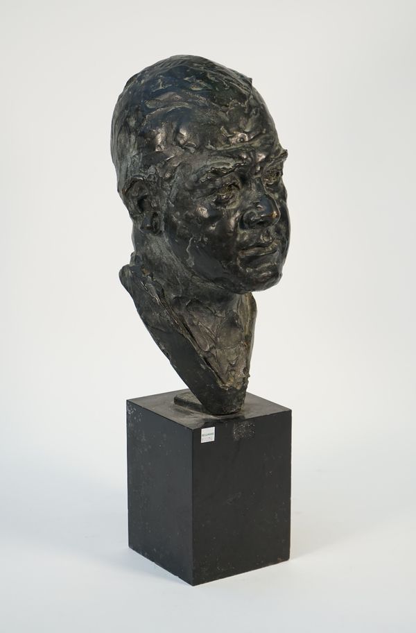 A bronze bust, late 19th century, depicting Dennis Daybell, (solicitor Lincoln Sinfield, London) raised on a black marble plinth, 60cm high.