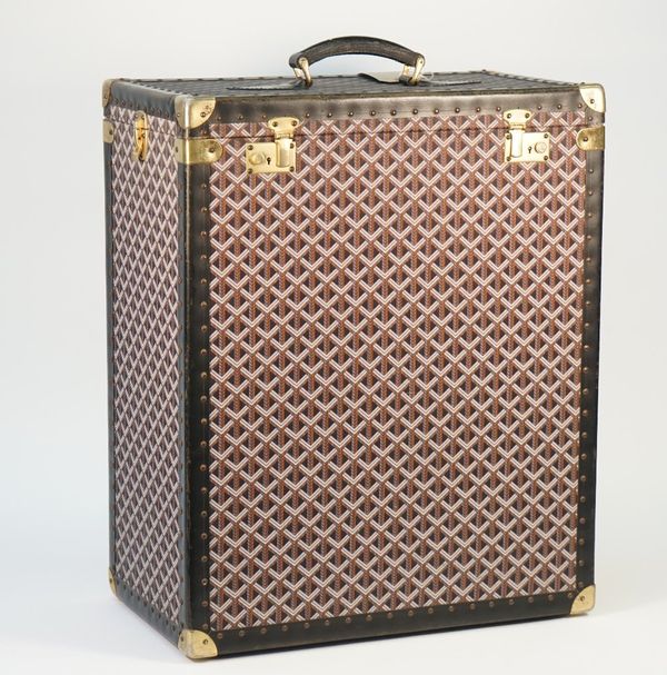 A Goyard style trunk with yellow lining and lift out trays, 60cm x 49cm x 30cm.