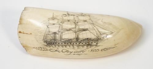 A mid-19th century scrimshaw whale tooth, detailed to one side in black ink 'The Tayleur 1853' with warship at full sail, 14cm.