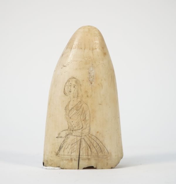 A mid-19th century scrimshaw whale tooth, detailed to both sides in black ink with a lady in Victorian dress, 13cm.