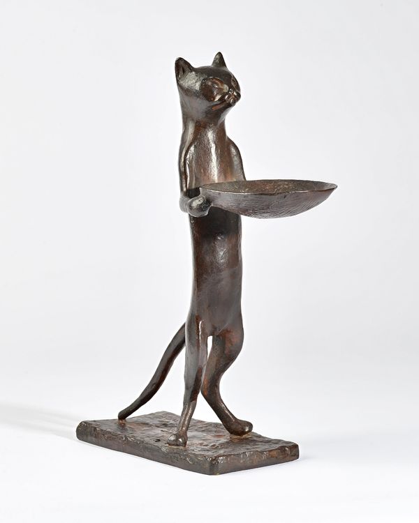 After Diego Giacometti (1902-1985), circa 1967, Chat Maitre su Hotel, bronze stylised cat holding a dish, signed 'Diego' to the cast, 30cm high. Illus