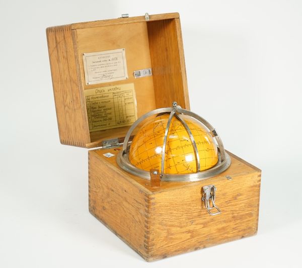 A Russian Soviet star finder, circa 1966, housed in a hinged wooden case, paper labels to interior, 24.5cm wide.