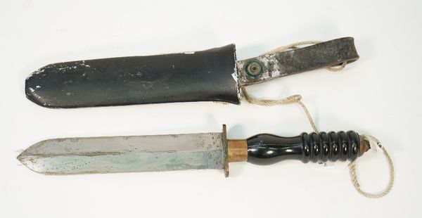 A Siebe Gorman diver's knife, circa 1960, with double edged steel blade, 19.5cm, resin/plastic handle and brass mounts, in an ebonised metal sheath, 3