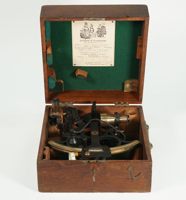 An ebonised brass sextant by Henry Hughes & Sons Ltd, circa 1955, in original fitted mahogany case.