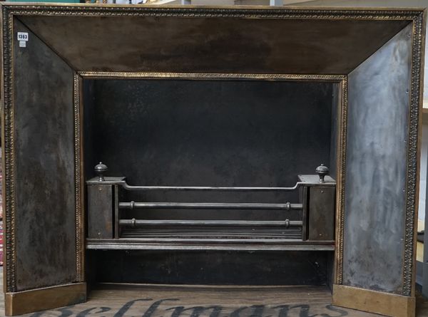 A Georgian style three bar steel fire grate and matching surround with a brass acanthus cast border, 118cm wide x 89.5cm high x 37cm deep.