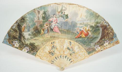 A Continental painted paper fan, late 18th century, detailed with figures in a garden against painted and pierced, carved ivory sticks, 29cm.