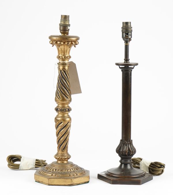 A Victorian style giltwood table lamp, the carved column on an octagonal foot, 42cm high and a patinated bronze table lamp, also on a hexagonal foot,