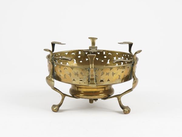 A Dutch 18th century brass brazier stand with pierced sides on three feet, 19.5cm diameter.