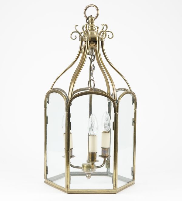 A Victorian style brass hall lantern of hexagonal form with an internal three light fitment, 56cm high.