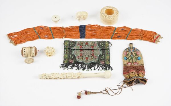 A 19th century ivory parasol handle carved with fruiting vine and detailed 'Jenny Campbell', 22.5cm, an ivory pin cushion, a 19th century ivory pot an