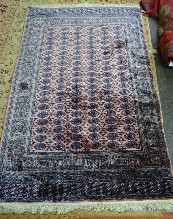 A machine made Bokhara design rug, 226cm x 150cm.   D1