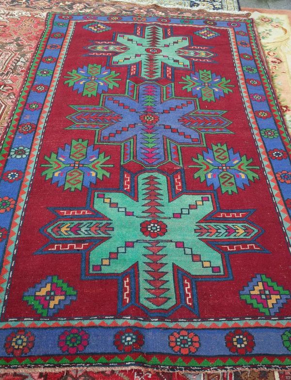 A Turkish rug, three medallions, 242cm x 147cm. C5