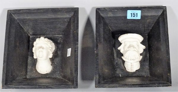 Two 20th century plaster heads within black painted pine frames, 16cm wide, (2).  S5M