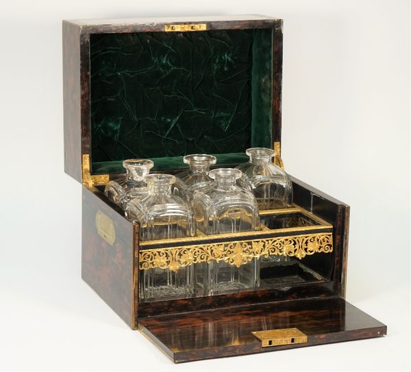 A 19th century brass inlaid coromandel decanter box, the rectangular lift top and full front revealing a six division interior and five decanters, 37c