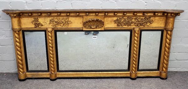 A Regency gilt framed triple plate overmantel mirror, with shell and ball mounted frieze and rope-twist mounts, 142cm wide x 60cm high.