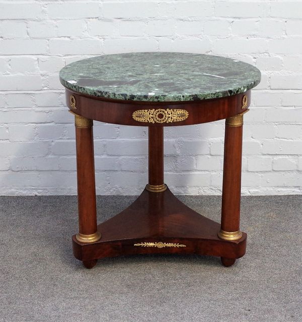 A late 19th century French Empire Revival gueridon, the circular marble top on three gilt metal moulded mahogany turned supports, united by platform u