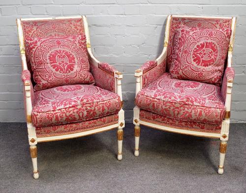 A pair of cream painted parcel gilt square back fauteuils of Louis XVI design, 58cm wide x 90cm long.
