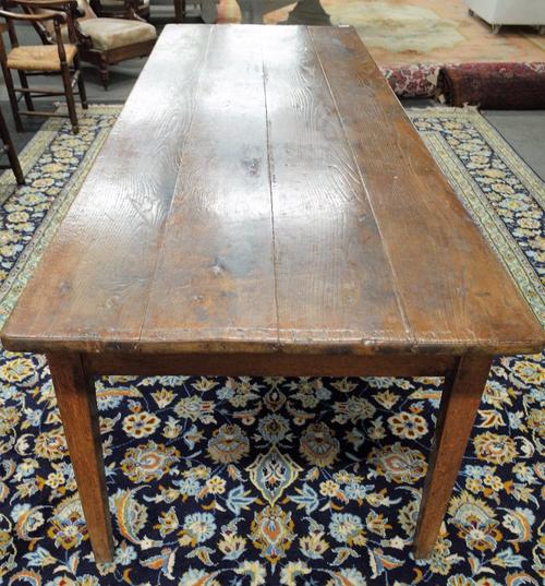 A late 18th century French oak kitchen table, the plank top over pair of frieze drawers on tapering square supports, 93cm wide x 267cm long.