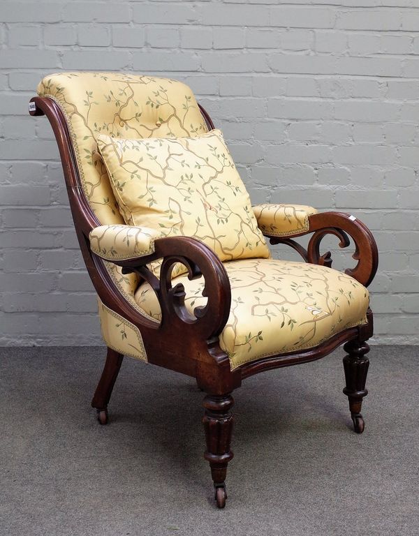 A William IV mahogany framed open armchair in silk bird print upholstery, on reeded supports, 69cm wide x 97cm high.