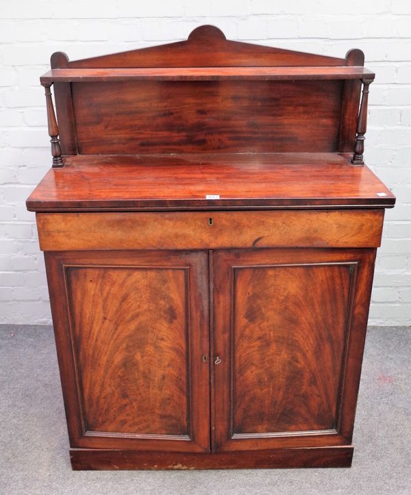 An early Victorian mahogany chiffonier, the ledge back over frieze drawer and pair of cupboards, 91cm wide x 130cm high.