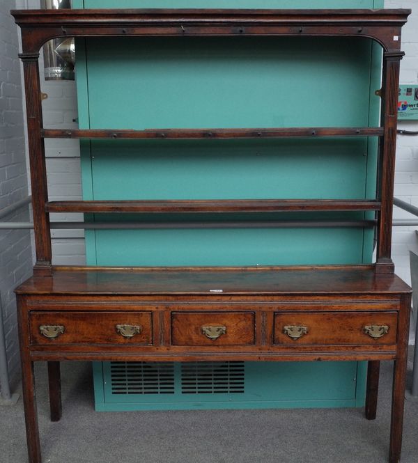 A mid-18th century oak dresser, the open two tier plate rack over three frieze drawers on rounded reeded supports, 163cm wide x 192cm high.