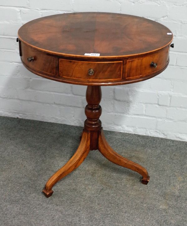 A George III style inlaid mahogany drum table, the cross banded top with four dummy and four true frieze drawers, on tripod base, 61cm diameter x 70cm