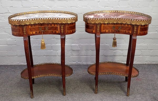 A pair of late 19th century French occasional tables, each with gilt metal mounted marble inset kidney shaped top over frieze drawer on cabriole suppo