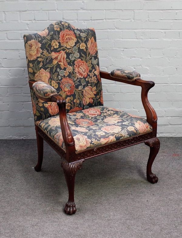 A mid-18th century style mahogany open arm/ Gainsborough style chair with carved frieze on ball and claw feet, 77cm wide x 110cm high.