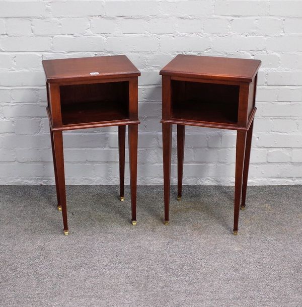 A pair of Louis XVI single bedside tables, each with recess on tapering square supports, 35cm wide x 68cm high.