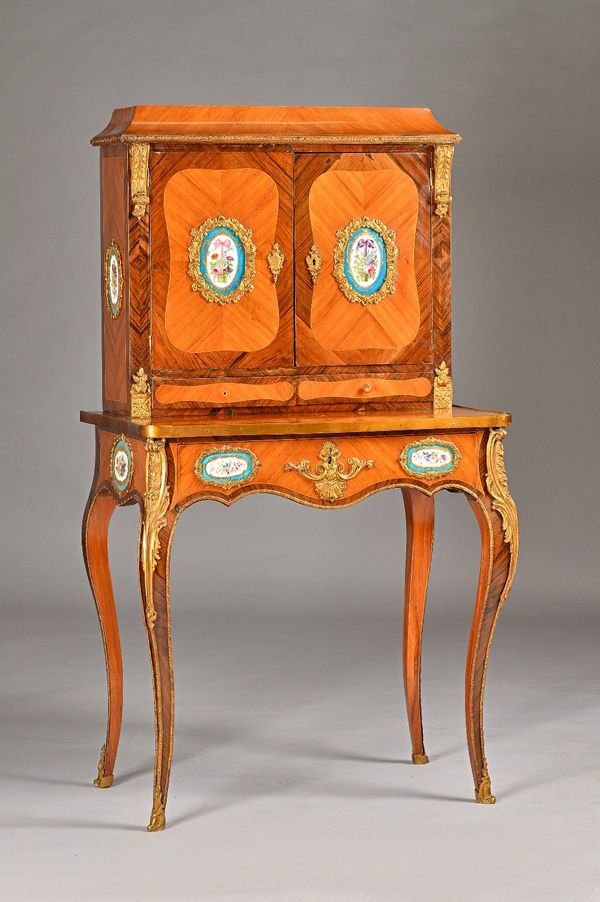 A late 19th century French gilt metal mounted and ceramic Kingwood and rosewood lady's writing desk, the caddy top over pair of cupboards and drawers,