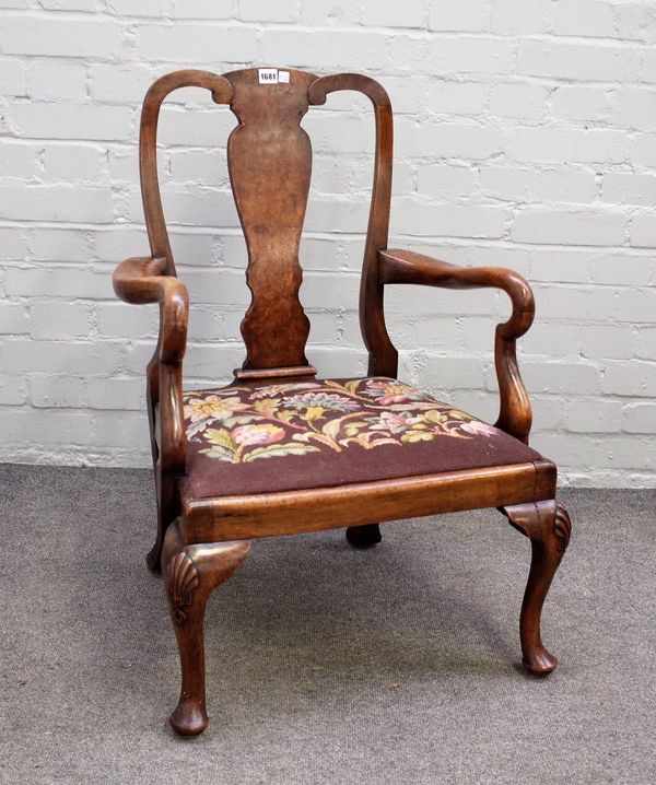 An early 18th century style figured walnut child's vase back open armchair on shell capped cabriole supports, 60cm wide x 84cm high.