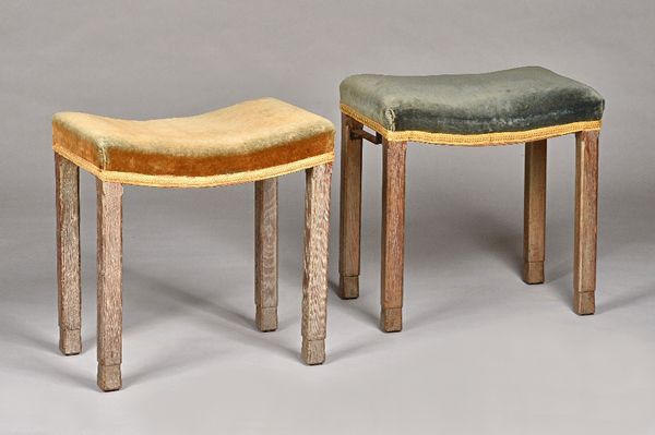 Two George VI limed oak Coronation stools both in original upholstery, 46cm wide x 48cm high. Illustrated.