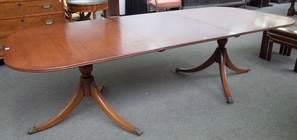 A Regency style mahogany 'D' end extending dining table on six downswept supports, one extra leaf, 108cm wide x 182cm long x 250cm long extended.